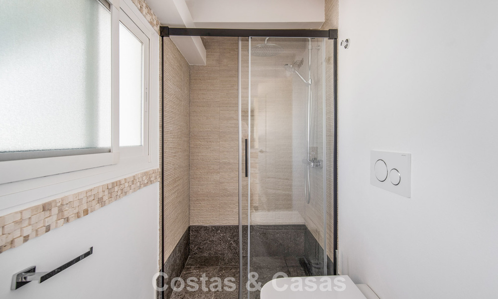 Stunning renovated 4-bedroom townhouse for sale with sea views, frontline beach location on Marbella’s Golden Mile 800861