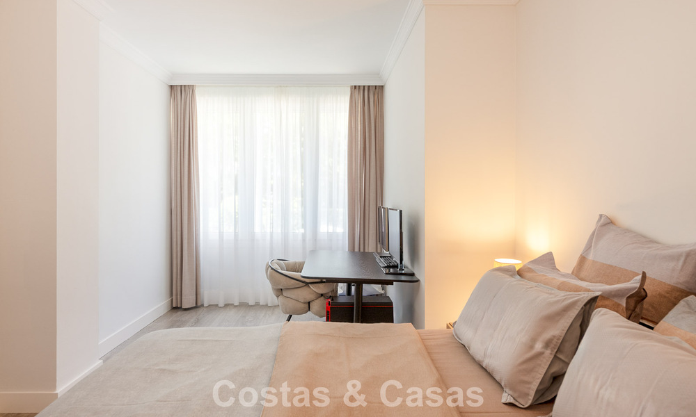 Luxury apartment with private garden and sea view for sale in Los Granados, a prestigious beachfront complex in Puerto Banús, Marbella 801894