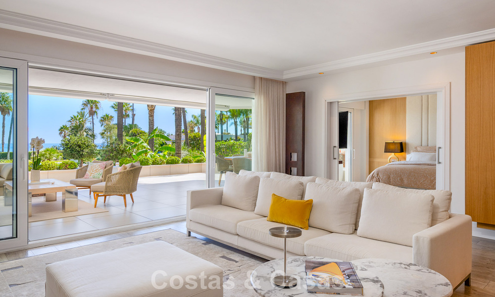 Luxury apartment with private garden and sea view for sale in Los Granados, a prestigious beachfront complex in Puerto Banús, Marbella 801896