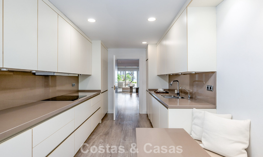 Luxury apartment with private garden and sea view for sale in Los Granados, a prestigious beachfront complex in Puerto Banús, Marbella 801903