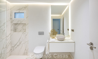 Luxury apartment with private garden and sea view for sale in Los Granados, a prestigious beachfront complex in Puerto Banús, Marbella 801904 