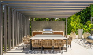 Modern luxury villa with heated swimming pool for sale in Nueva Andalucía's Golf Valley, Marbella 802002 