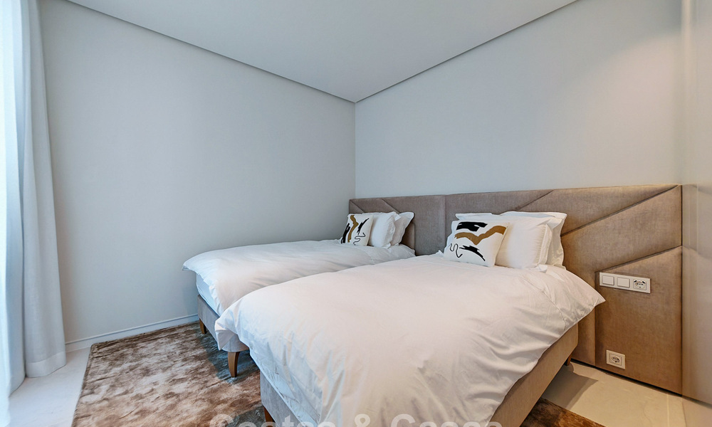 Modern garden apartment with sea views for sale in an exclusive boutique development near Marbella 802615