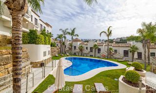 Move-in ready townhouses with mediterranean architecture for sale directly on the golf course in Estepona 806874 