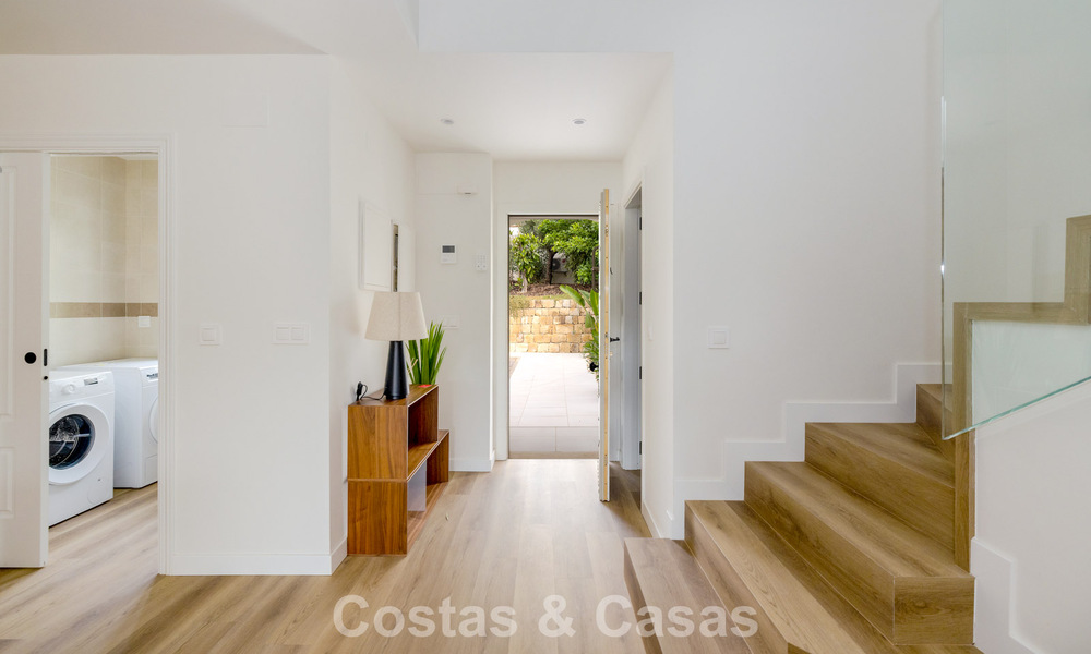Move-in ready townhouses with mediterranean architecture for sale directly on the golf course in Estepona 806883