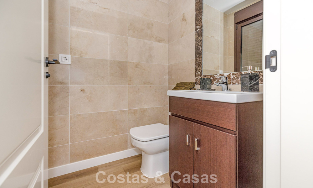 Move-in ready townhouses with mediterranean architecture for sale directly on the golf course in Estepona 806903