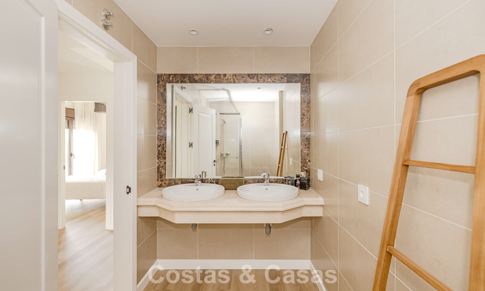 Move-in ready townhouses with mediterranean architecture for sale directly on the golf course in Estepona 806912