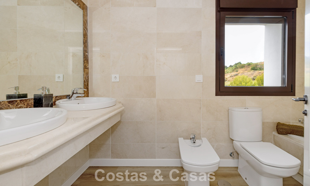 Move-in ready townhouses with mediterranean architecture for sale directly on the golf course in Estepona 806921
