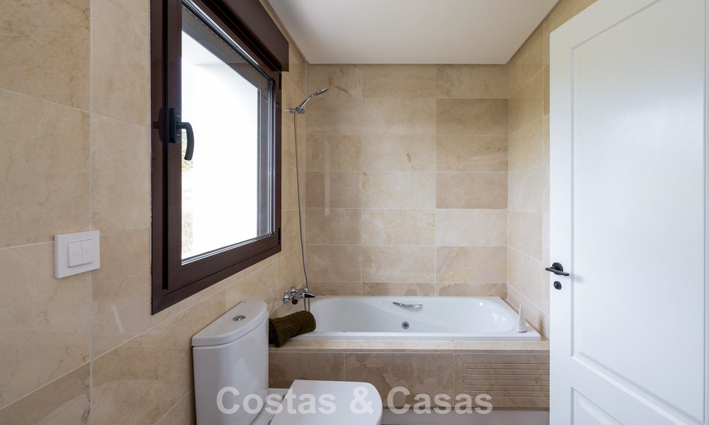 Move-in ready townhouses with mediterranean architecture for sale directly on the golf course in Estepona 806923